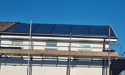 New slate roof with Marley solar panels installed